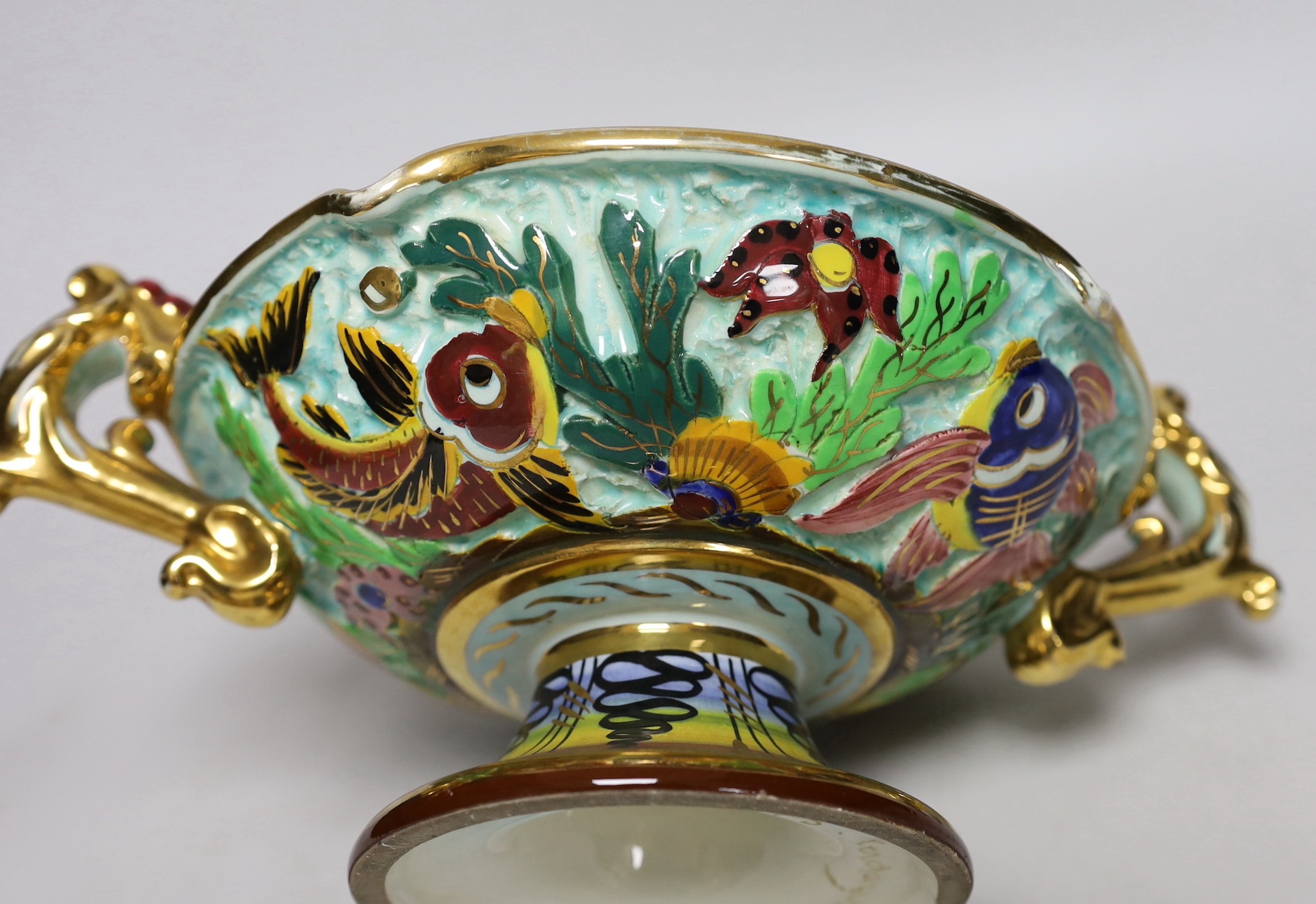A French tazza with two handles, vibrant colours and a gilt and enamel box and cover, Tarzan 30cms wide